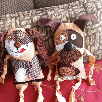 Two handmade Scrappy Dog Dolls — a brown puppy and a tan terrier with button eyes