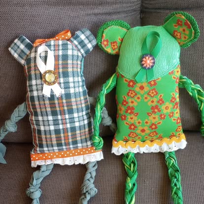 A pair of mouse-eared Scrappy Dolls — one in plaid fabric, one in green floral fabric
